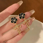 Black Flower golden earrings